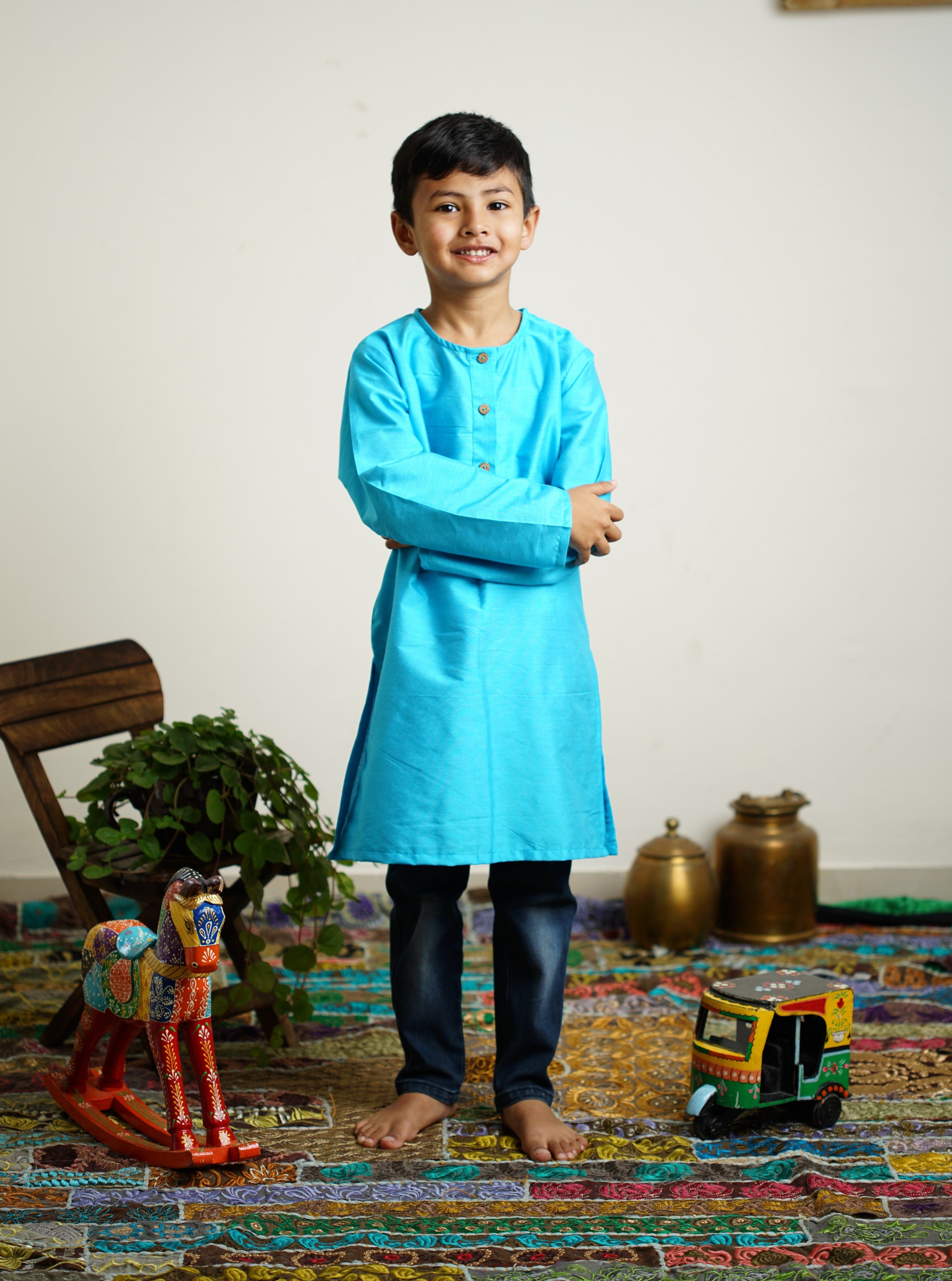 Sky Blue cotton silk Round neck long kurta with wooden buttons.Kurtas with collar or Angrakha pattern teamed with salwar are the best choice for any festive occasion for boys.They are Trendy, Easy to wear and comfortable to carry.
