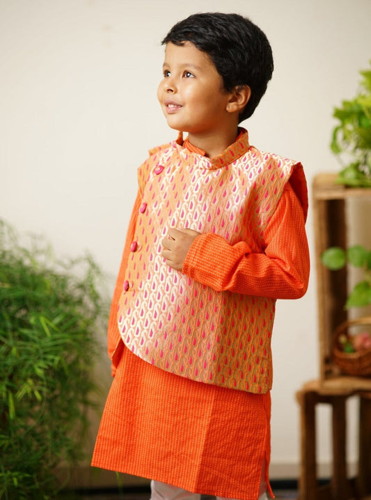Parsley patterned orange & pink brocade jacket.Cotton lining from inside avoid sweating but give warmth.Statement embellished buttons add royal charm to these jackets. Team these with any plain colored kurta or satin shirt for best festive look!