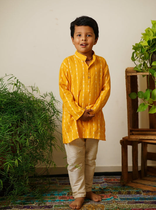 Mango yellow Handloom Cotton Stand Collar Kurta.Kurtas with collar or Angrakha pattern teamed with salwar are the best choice for any festive occasion for boys.They are Trendy, Easy to wear and comfortable to carry.