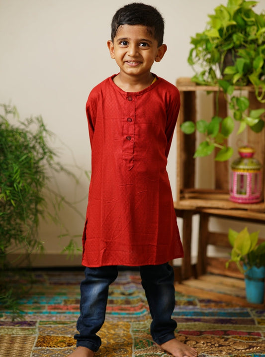 Tomato red cotton round neck Kurta.Kurtas with collar or Angrakha pattern teamed with salwar are the best choice for any festive occasion for boys.They are Trendy, Easy to wear and comfortable to carry.