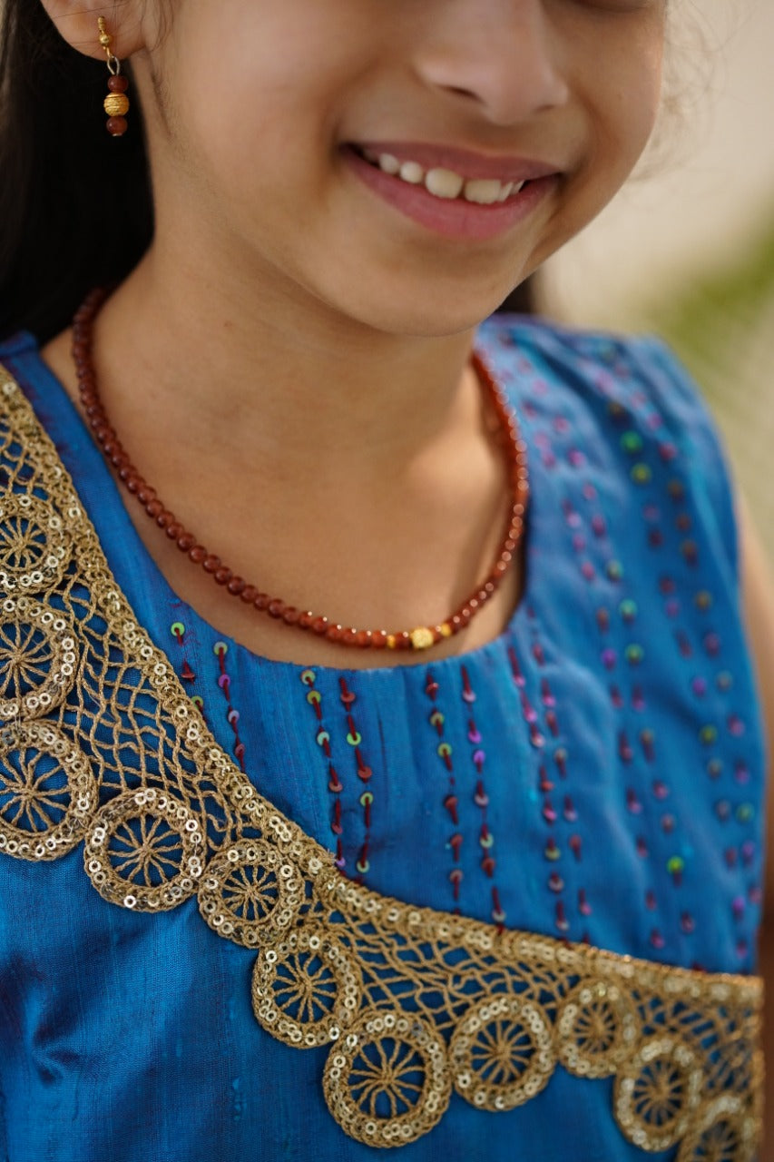 Brocade chanderi coffee brown sharara pants with peacock blue pure raw silk tunic.Let your princess be as comfortable as in her casuals with carefully designed & crafted Comfort Ethnic Wear by Soyara Ethnics.Keep her fashion quotient high with timeless patterns, vibrant combinations and royal textiles.