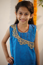 Brocade chanderi coffee brown sharara pants with peacock blue pure raw silk tunic.Let your princess be as comfortable as in her casuals with carefully designed & crafted Comfort Ethnic Wear by Soyara Ethnics.Keep her fashion quotient high with timeless patterns, vibrant combinations and royal textiles.