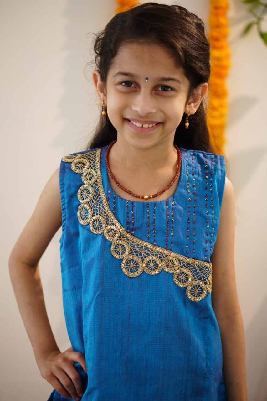 Brocade chanderi coffee brown sharara pants with peacock blue pure raw silk tunic.Let your princess be as comfortable as in her casuals with carefully designed & crafted Comfort Ethnic Wear by Soyara Ethnics.Keep her fashion quotient high with timeless patterns, vibrant combinations and royal textiles.