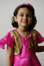 Lilac plain satin taffeta dhoti with Peplum false jacket top.Let your princess be as comfortable as in her casuals with carefully designed & crafted Comfort Ethnic Wear by Soyara Ethnics.Keep her fashion quotient high with timeless patterns, vibrant combinations and royal textiles.