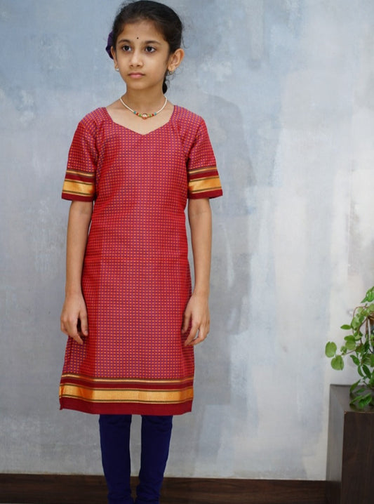 Multicolour Handloom Khunn Kurti with Maroon Border.Let your princess be as comfortable as in her casuals with carefully designed & crafted Comfort Ethnic Wear by Soyara Ethnics.Keep her fashion quotient high with timeless patterns, vibrant combinations and royal textiles.